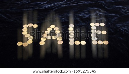 Sale sign, lined with 10-ruble coins (written ten rubles, the Bank of Russia in the Russian) on black background   