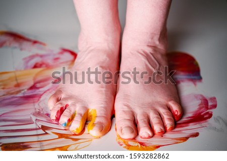 Foot painted with multi-colored acrylic paint