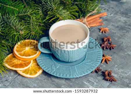 Cup of hot chocolate in winter decorations on the rustic background. Selective focus. Shallow depth of field.
