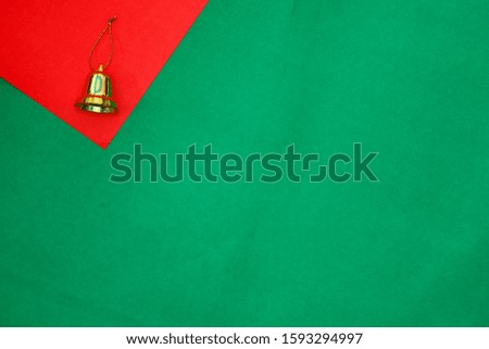 golden ring on red and green background with copy space for new year and christmas time