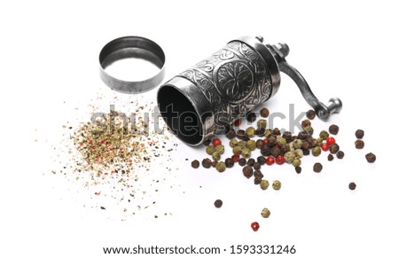 Retro silver pepper mill, grain and minced colorful pepper isolated on white