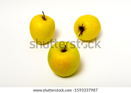 Fresh green apples on white background. Healthy food. Vegan food. Isolated