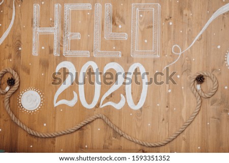 2020 New Year number on wooden background. Christmas holidays