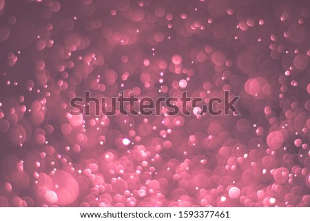 Abstract bokeh lights with light red background, beautiful bokeh from water droplets
