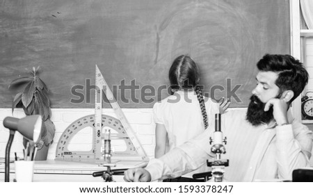 enjoy study. math geometry. biology chemistry lesson. father and daughter study in classroom. protractor ruler with setsquare. bearded man teacher with small girl use book microscope.