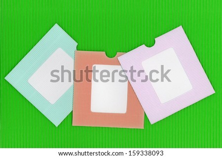  paper frames on green paper  background