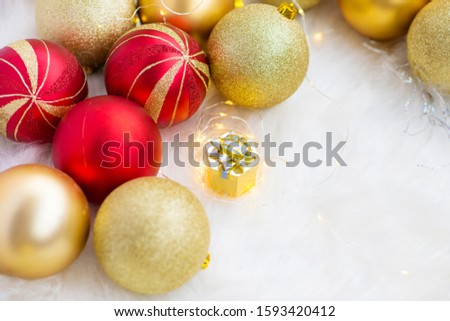 Golden gift for girls on Christmas decorations and Christmas lights, gift in the new year