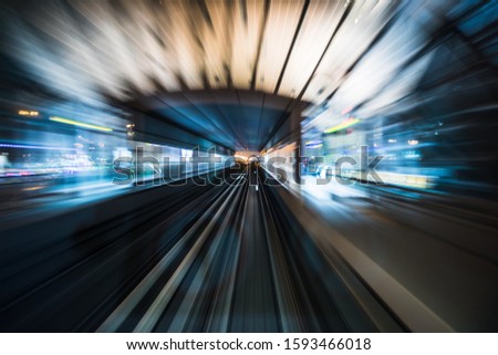 Tran running on rails in a night city., blurred motion with light.
