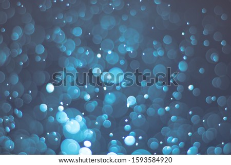 Abstract bokeh lights with light Blue background, beautiful bokeh from water droplets
