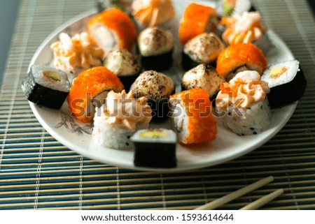 Handmade fresh sushi set. Sushi Roll with salmon, eel, tuna, avocado, royal prawn, cream cheese Philadelphia, caviar tobica, chuka. Sushi menu. Japanese food.