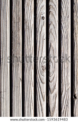 A large wooden fence. Wood background texture, shed boards.