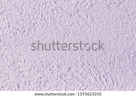 Decorative wall with purple cement.  Violet concrete wall texture for background and wallpaper.