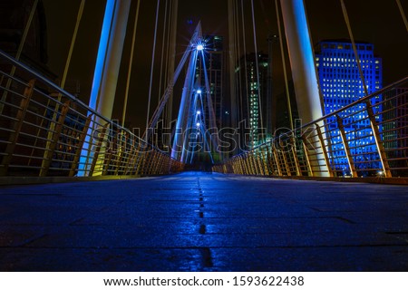 Footbridge in London at night