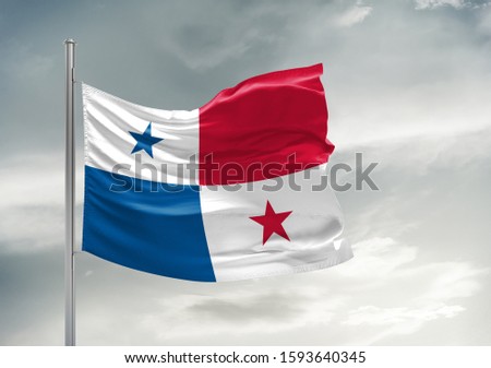 Panama national flag cloth fabric waving on beautiful grey sky.