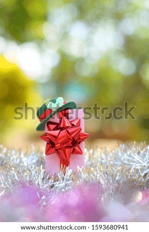 Small gift box over blur background,Celebration concept.