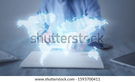 Man touching world map in office.