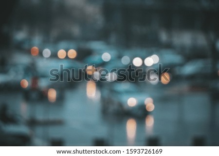Unfocused picture of traffic in rainy day