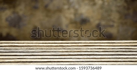 Background in natural tones - thin wooden boards in front of marbled wall
