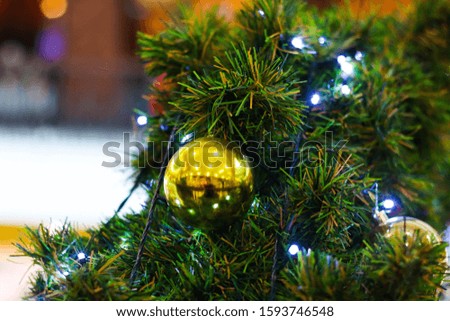 decorations on a Christmas tree and glare of lights.