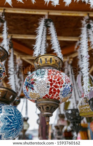 Souvenirs, colorful lambs, Turkish symbols hanging on frozen in winter; Cappadocia, Nevsehir Turkey