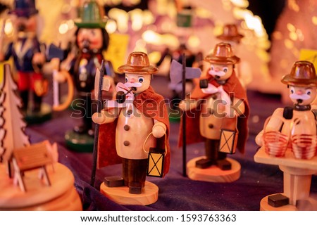 traditional wooden art figures on a traditional christmas market