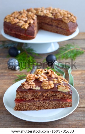 Nut cake with chocolate ganache and walnuts for Christmas