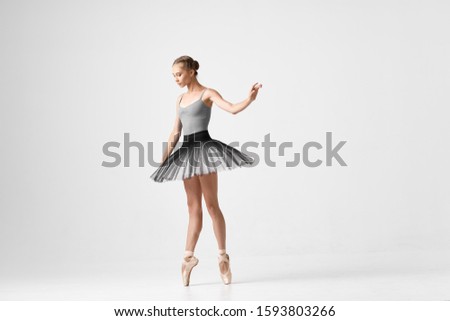 Woman ballerina dance exercises performing elasticity