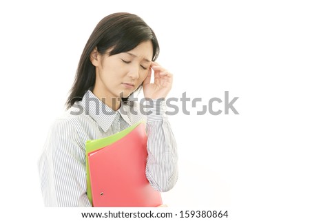 Tired and stressed young Asian woman