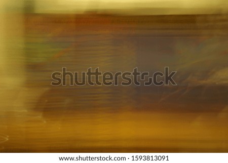 Abstract colorful stripes and spots of light texture with a dark background. Slow shutter speed.