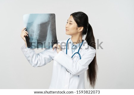Female doctor in a medical coat x-ray cropped view