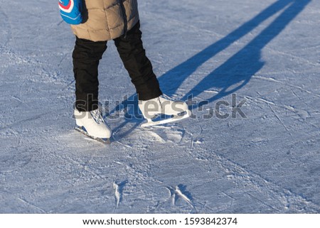 A woman skates in sunny weather. Women's skates close-up,