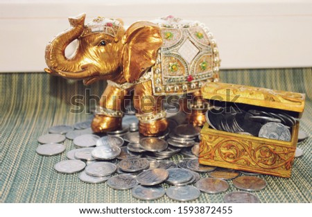 Silver and gold coins in a chest