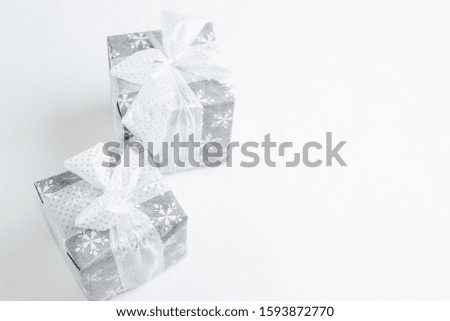 Christmas gift box with festive decoration on white background