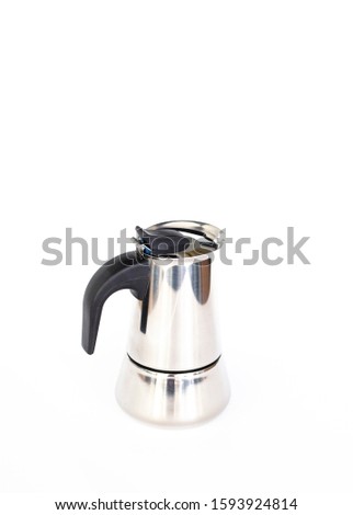 Metallic coffee maker isolated on the white background. Kitchenware for preparing coffee. Espresso maker, top view. Banner template with copy space.