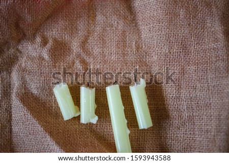 Candles placed on brown fabric
