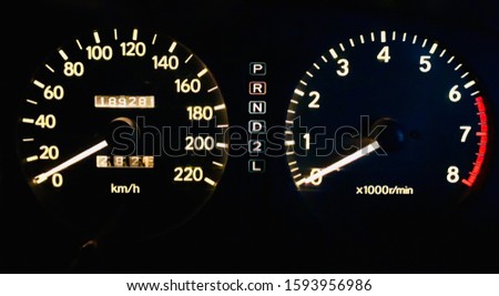 arrows at night with a speedometer, tachometer and other tools to monitor the condition of the vehicle in modern style on black isolated background.