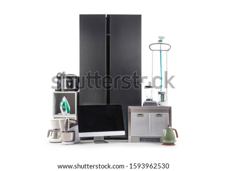 Modern refrigerator and domestic appliances isolated on white Royalty-Free Stock Photo #1593962530