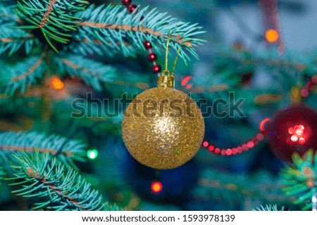 Merry Christmas and Happy New year Holidays! Macro or close picture of xmas tree and bulbs. Selective focus.