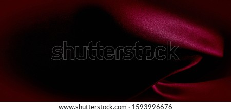 texture, red silk fabric panoramic photo. Silk Duke mood satin - beautiful and regal. It has a darker luster, then the usual satin on the one hand, has an average weight and has a more solid hand.