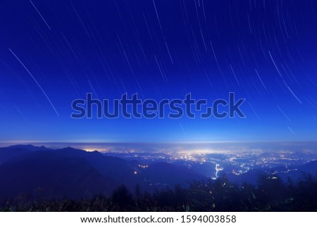 The top of Alishan Gap in Taiwan,Starry sky and flowing clouds at night.