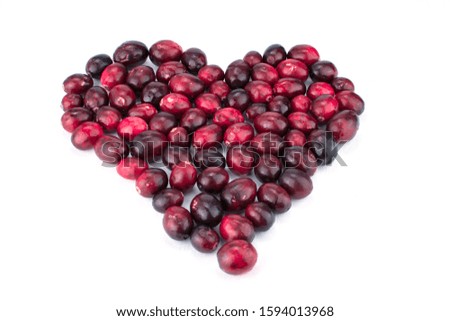 fresh  tasty big cranberry  heart shape on white background