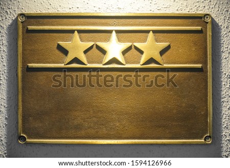 Beautiful HOTEL  sign with  three 3 stars metallic plate next to entrance door. 3 three golden stars. deutsche hotelklassifizierung - German hotel classification. gültig bis 2021 - Date of Expiry.