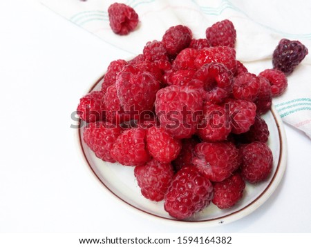 Raspberries 
juicy , vegan , tasty berry 
on white background , raw, fresh, natural, summer, food photo
