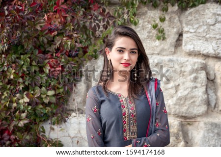 Portrait of indian girl in traditional dress. Traditional accessories of Indian girls.  Royalty-Free Stock Photo #1594174168