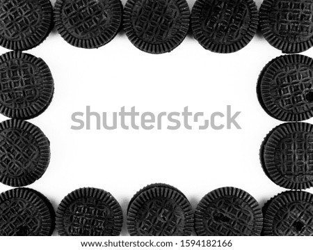 A frame made of sandwich cookies on white background