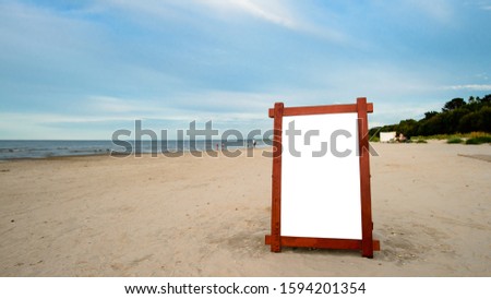billboard on the beach. advertising frame on the beach Layout with free text space for your design collage