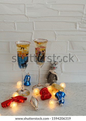 Christmas decorations on a light background. Christmas rat Symbol of the new year 2020. Christmas card. Chinese New Year 2020. Christmas toys, bokeh. Happy New Year. New Year concept. Rat on the backg