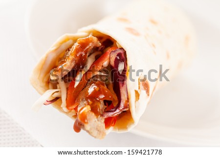 tortilla fajita wraps with meat and vegetables