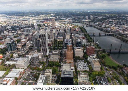 Aerial view of buildings, bridges, towers, streets and the Williamette River in downtown Portland, Oregon, USA.