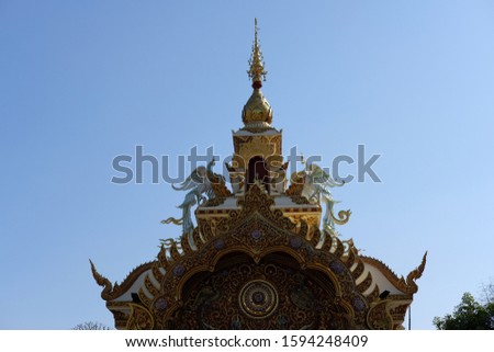 Roof in temple of Thailand on blue sky background 